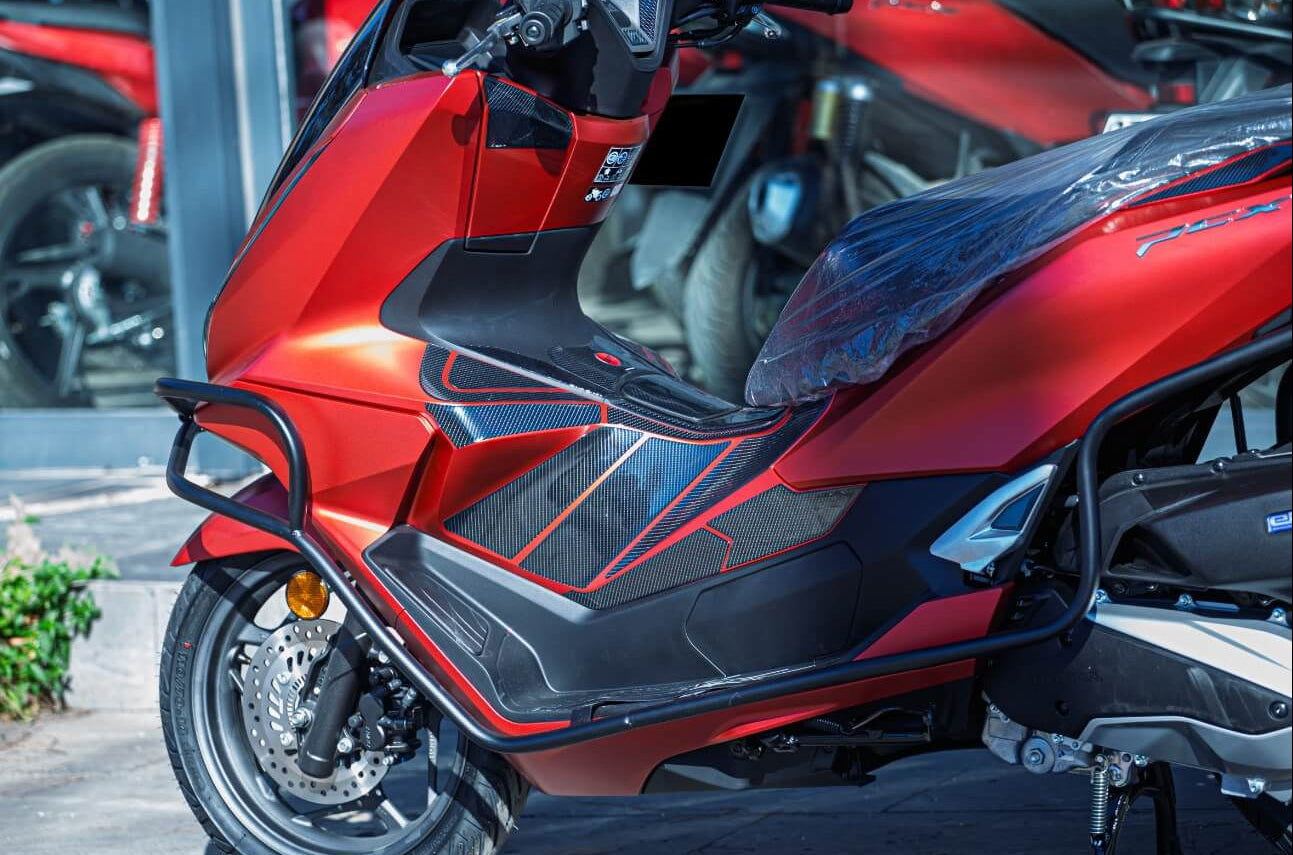 Red and black scooter with full tank pad protection